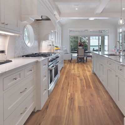wood look laminate flooring in a bright open kitchen